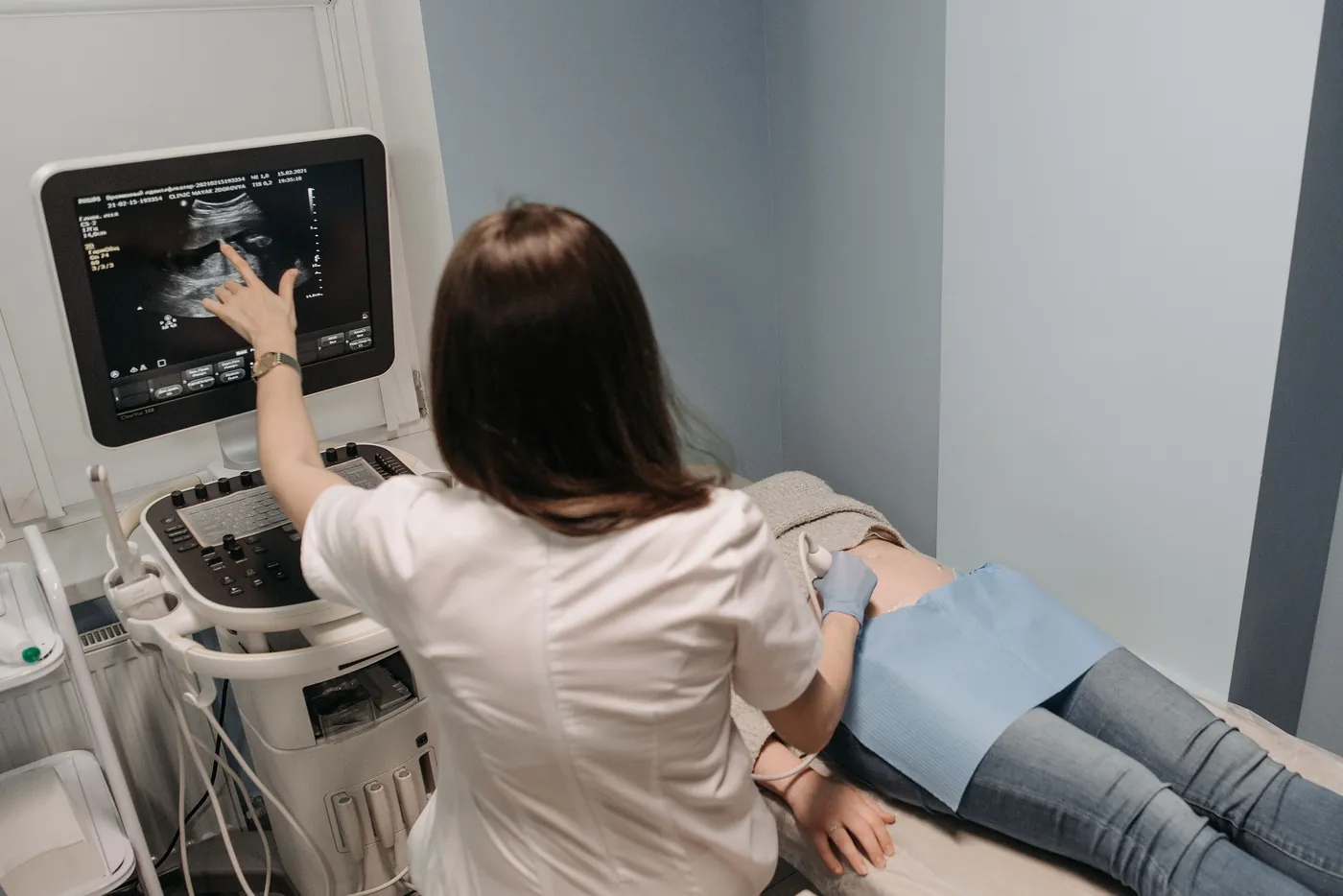 Doctor guiding a patient through an ultrasound examination
