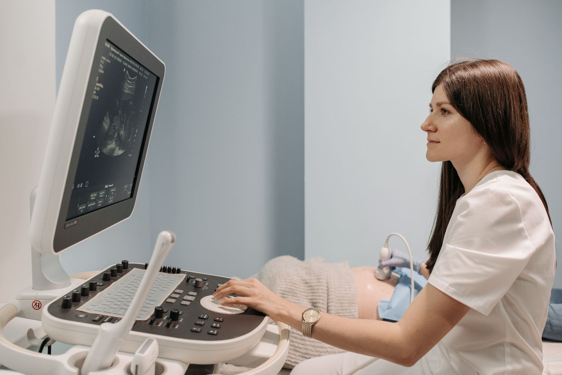 Doctor performing an ultrasound examination in a modern diagnostic clinic